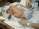 Getting cleaned up in the delivery room.
